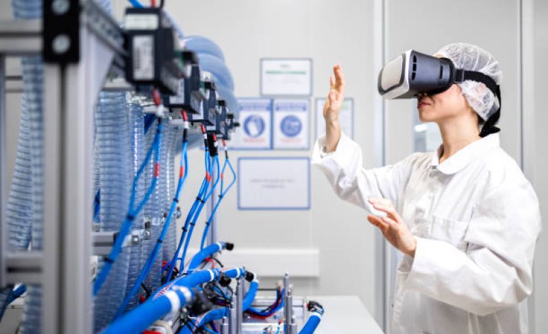 Japanese engineer expert using VR glasses to visualise new prototype machine.